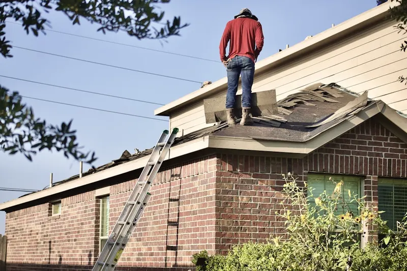 Professional roofer working on a residential roof in Greater Harmony Hils